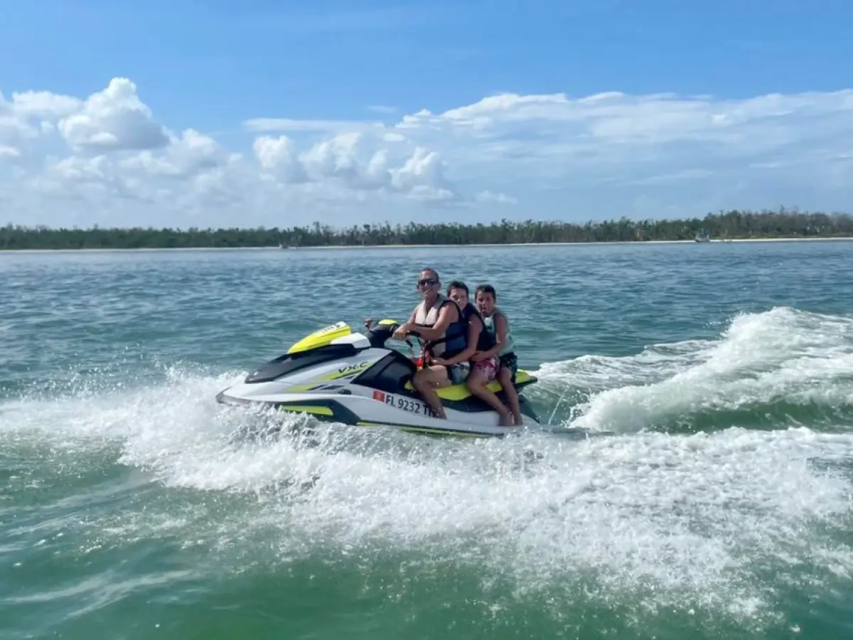 a man riding a wave on top of a body of water