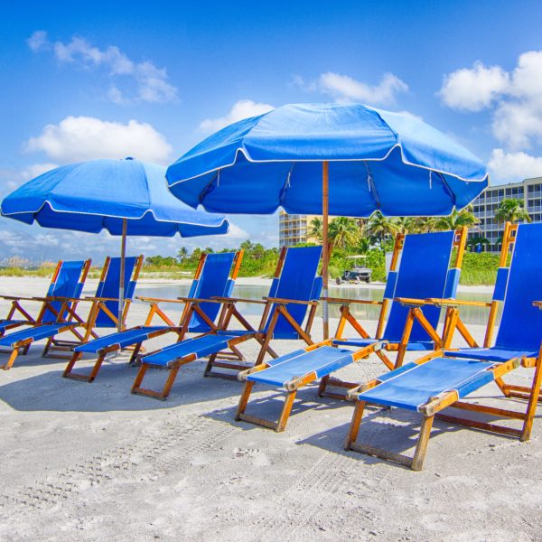 a group of beach chairs and umbrellas onf Fort Myers Beach