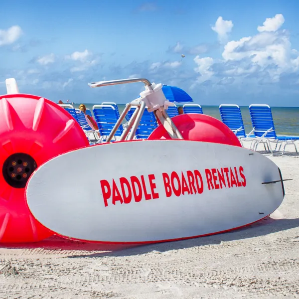 paddle board sign on beach
