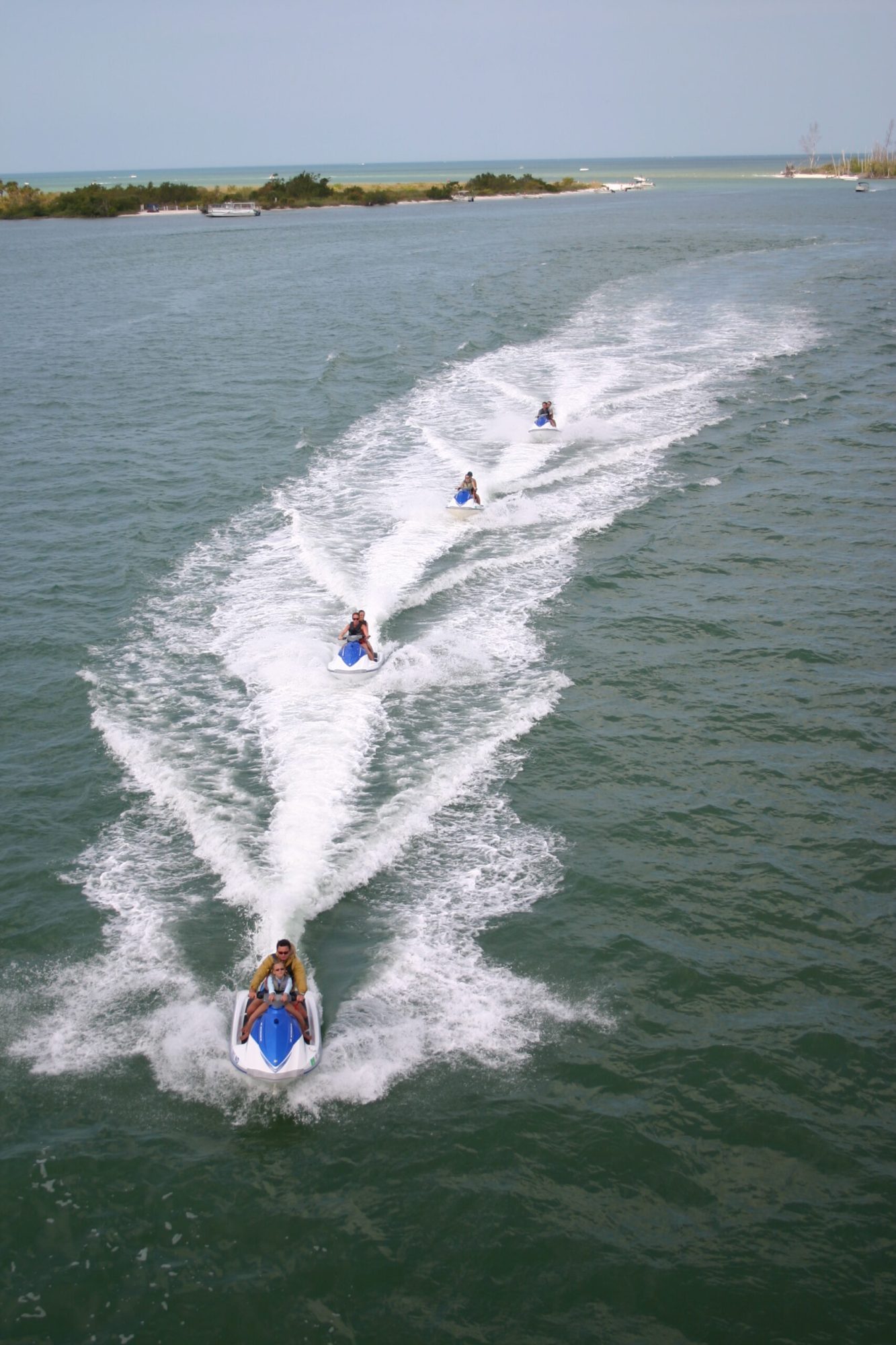 a line of waverunners in the water
