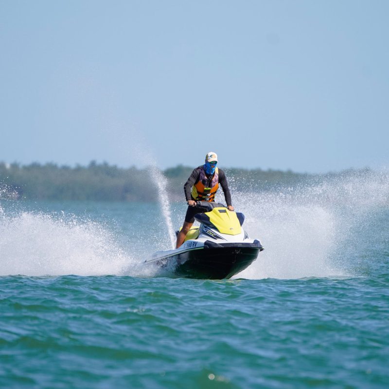 a man water skiing behind a boat