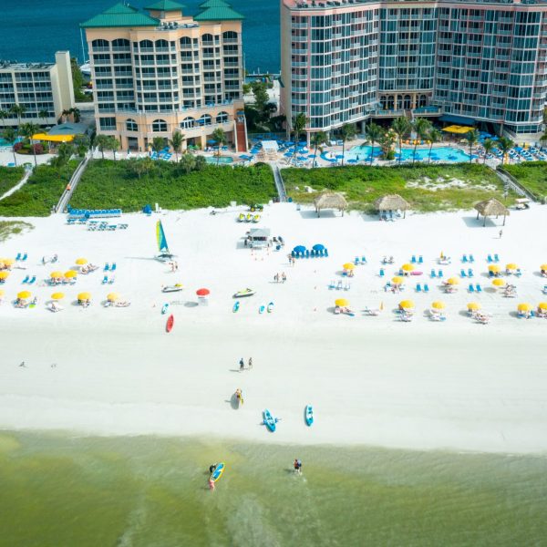 a beach with chairs and umbrellas